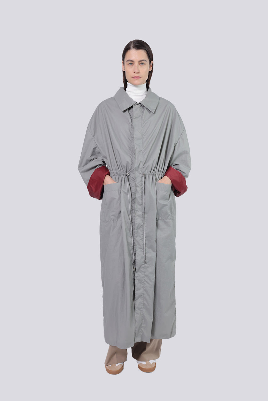 Coquette women's designer maxi raincoat, stylish and functional outerwear for all weather, perfect for casual and chic rainy day outfits.